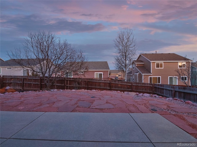 view of patio terrace at dusk