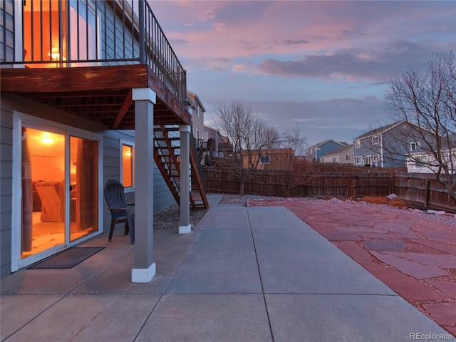 view of patio terrace at dusk