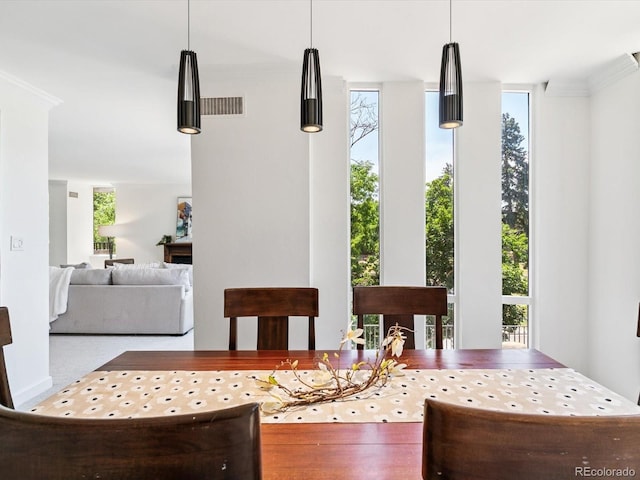 1111 Race St Unit 3A, Denver, CO 80206 - dining area with ornamental molding and a wall of windows