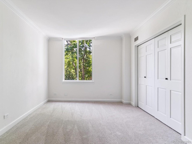 1111 Race St Unit 3A, Denver, CO 80206 - unfurnished bedroom with ornamental molding, carpet floors, and a closet
