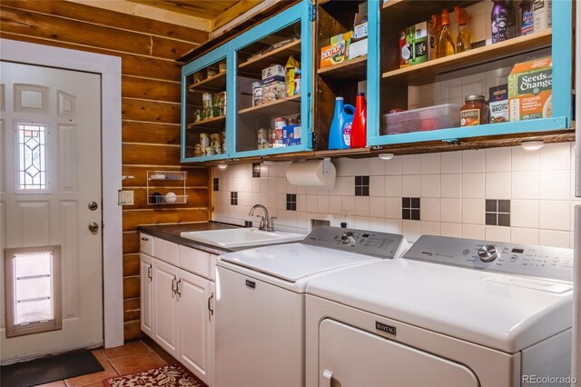 361 Crystal Peak Rd, Florissant, CO 80816 - washroom with plenty of natural light, cabinets, separate washer and dryer, sink, and light tile patterned floors