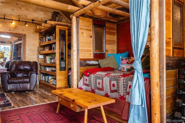 361 Crystal Peak Rd, Florissant, CO 80816 - sitting room with wood walls and hardwood / wood-style floors