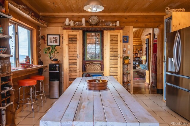 361 Crystal Peak Rd, Florissant, CO 80816 - tiled dining area featuring wood ceiling and rustic walls