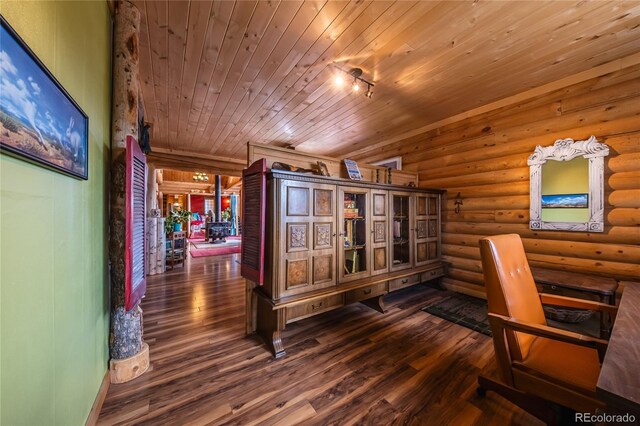361 Crystal Peak Rd, Florissant, CO 80816 - interior space featuring log walls, dark hardwood / wood-style floors, and wooden ceiling