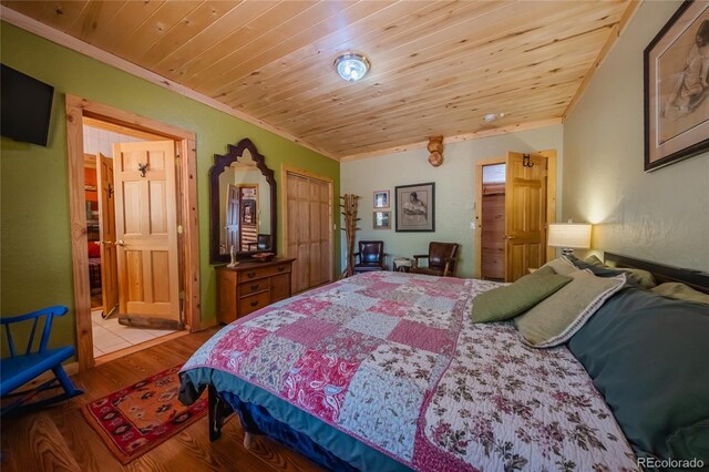 361 Crystal Peak Rd, Florissant, CO 80816 - bedroom with ornamental molding, light wood-type flooring, and wooden ceiling