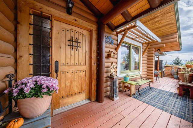 361 Crystal Peak Rd, Florissant, CO 80816 - view of exterior entry featuring a deck