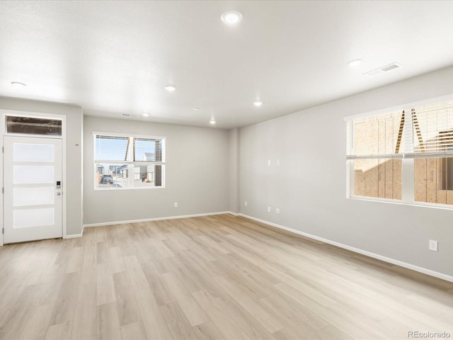 764 N Tempe St, Aurora, CO 80018 - spare room featuring recessed lighting, baseboards, visible vents, and light wood-style flooring