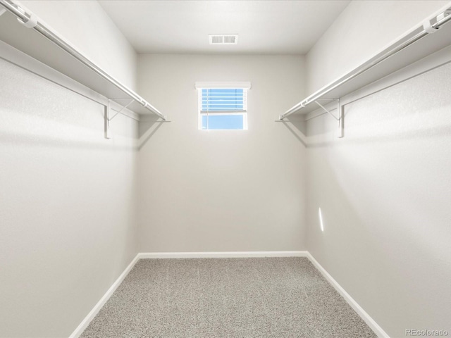 764 N Tempe St, Aurora, CO 80018 - walk in closet featuring carpet floors and visible vents