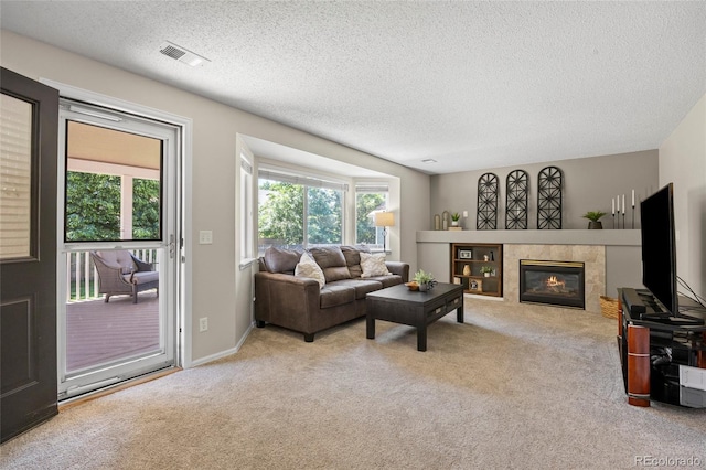 20858 E Progress Ave, Centennial, CO 80015 - carpeted living area with a textured ceiling and a fireplace