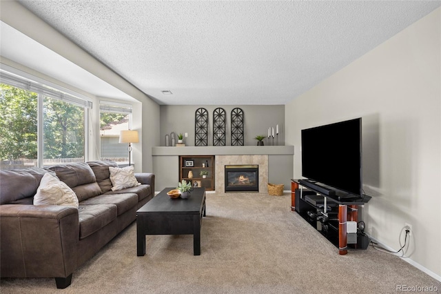 20858 E Progress Ave, Centennial, CO 80015 - living room featuring carpet floors, a textured ceiling, and a tile fireplace