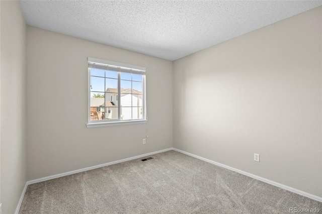 20858 E Progress Ave, Centennial, CO 80015 - unfurnished room featuring carpet flooring and a textured ceiling