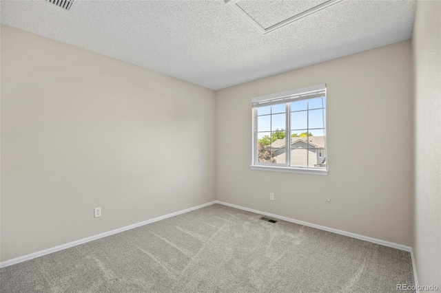 20858 E Progress Ave, Centennial, CO 80015 - carpeted spare room featuring baseboards and a textured ceiling