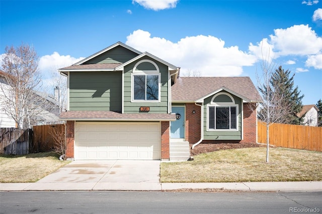 split level home featuring concrete driveway, brick siding, and fence