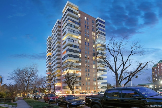 view of outdoor building at dusk