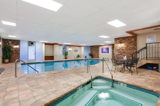 pool with an indoor hot tub