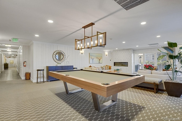 playroom with wooden walls, carpet floors, crown molding, and pool table