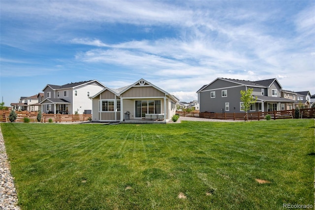 944 Alpine Ridge St, Erie, CO 80516 - rear view of property featuring board and batten siding, a patio area, and a residential view