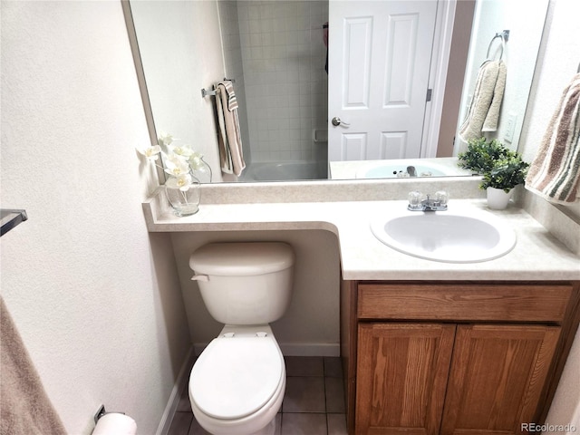 full bathroom with tile patterned floors, vanity, toilet, and tiled shower / bath