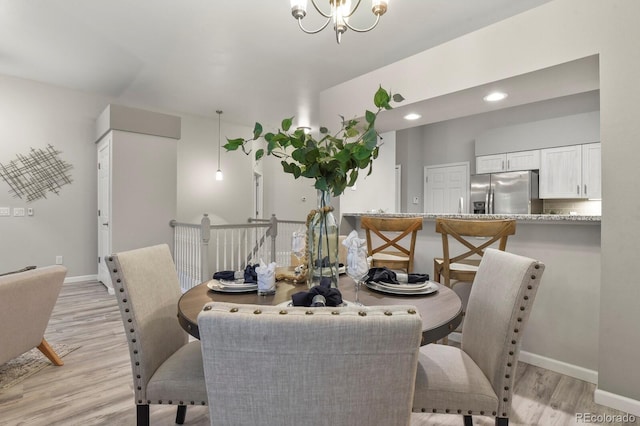 6868 Los Reyes Cir, Colorado Springs, CO 80918 - dining room featuring light wood-style floors, baseboards, a chandelier, and recessed lighting