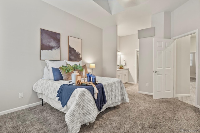 6868 Los Reyes Cir, Colorado Springs, CO 80918 - carpeted bedroom featuring ensuite bath and baseboards