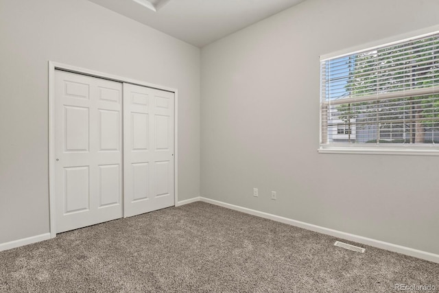 6868 Los Reyes Cir, Colorado Springs, CO 80918 - unfurnished bedroom with carpet floors, baseboards, and a closet