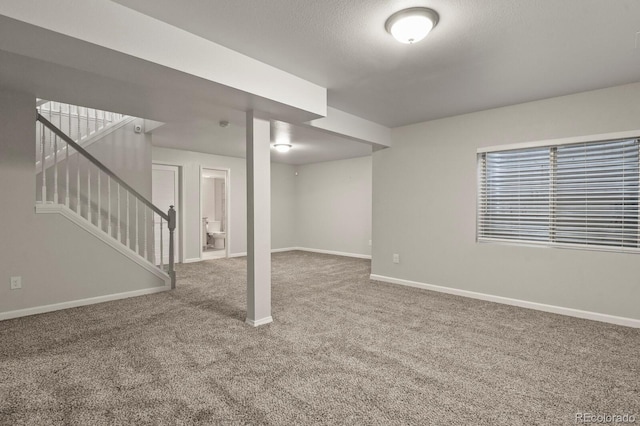 6868 Los Reyes Cir, Colorado Springs, CO 80918 - basement featuring carpet flooring, baseboards, and stairs