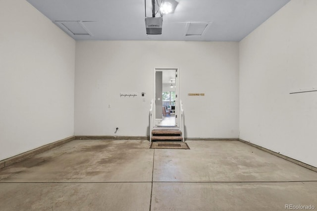 6868 Los Reyes Cir, Colorado Springs, CO 80918 - garage featuring a garage door opener and baseboards