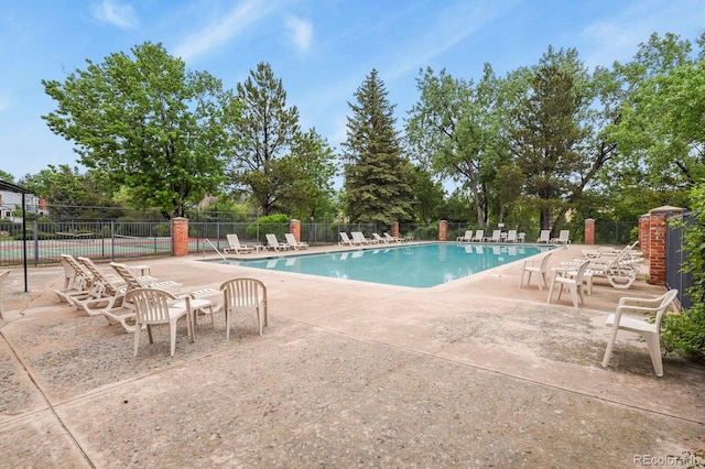 6868 Los Reyes Cir, Colorado Springs, CO 80918 - community pool featuring a patio area