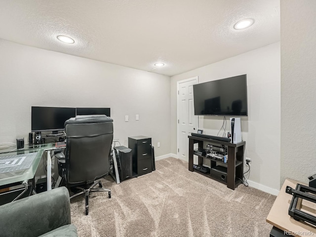 carpeted office with a textured ceiling