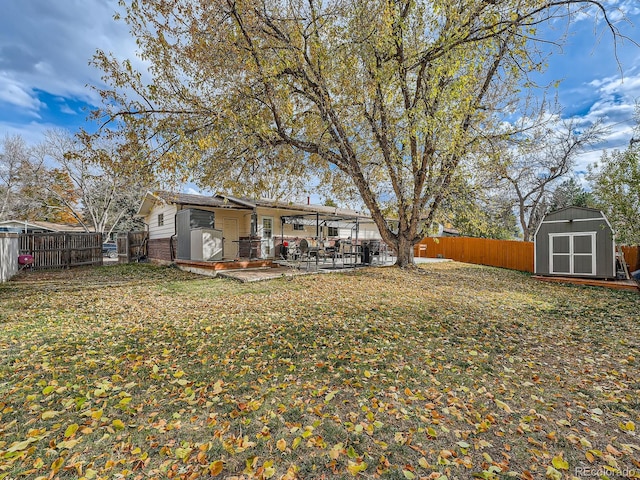 view of yard with a patio area and a shed