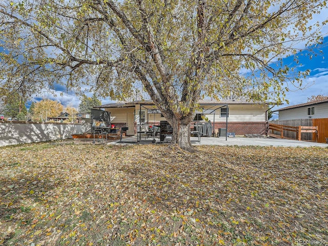 rear view of house with a patio