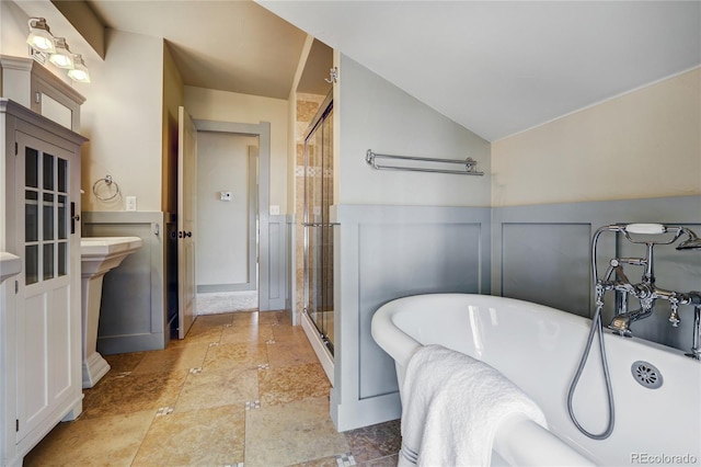 bathroom with tile flooring, lofted ceiling, and plus walk in shower