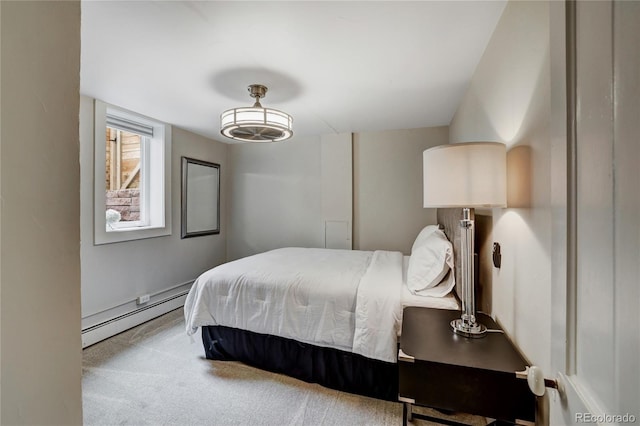 carpeted bedroom featuring a baseboard radiator