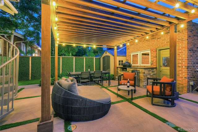 view of patio / terrace featuring a pergola and a storage shed