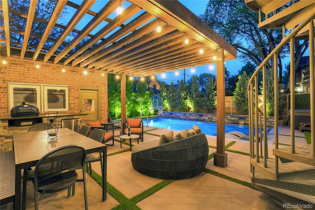 view of patio / terrace featuring grilling area, pool water feature, and a pergola