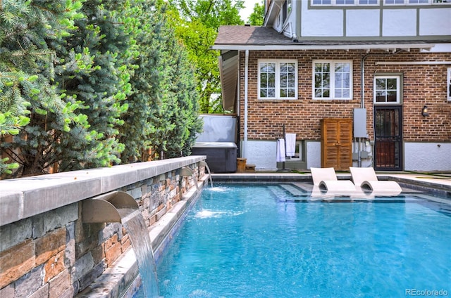 view of pool with pool water feature