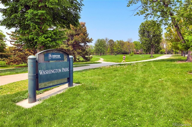 community / neighborhood sign with a lawn