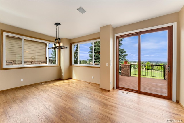 6323 S Sicily Way, Aurora, CO 80016 - spare room with light wood-style flooring and baseboards