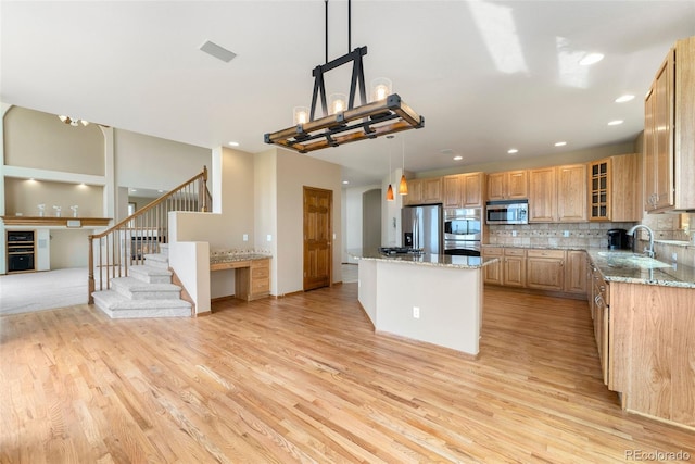 6323 S Sicily Way, Aurora, CO 80016 - kitchen featuring stainless steel appliances, light wood-style floors, light stone countertops, backsplash, and recessed lighting