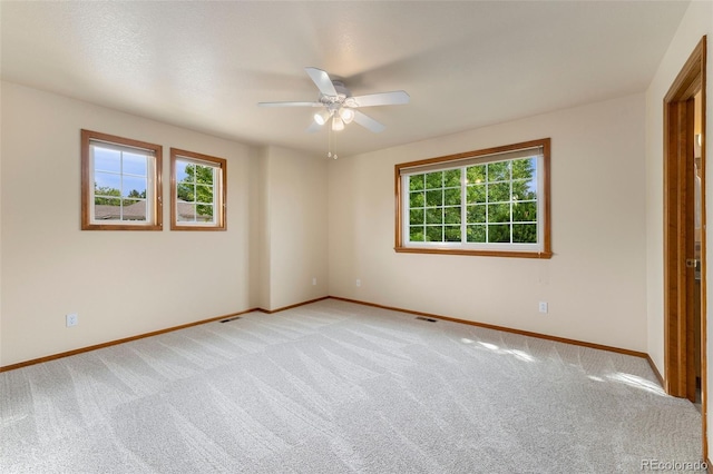 6323 S Sicily Way, Aurora, CO 80016 - unfurnished bedroom with light colored carpet, baseboards, and a ceiling fan
