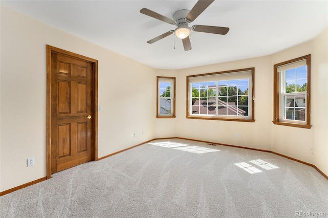6323 S Sicily Way, Aurora, CO 80016 - carpeted empty room featuring baseboards and a ceiling fan