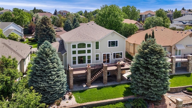 6323 S Sicily Way, Aurora, CO 80016 - back of house with a residential view, a deck, stairway, and a yard