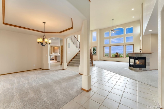6323 S Sicily Way, Aurora, CO 80016 - unfurnished living room with light colored carpet, baseboards, stairs, and recessed lighting