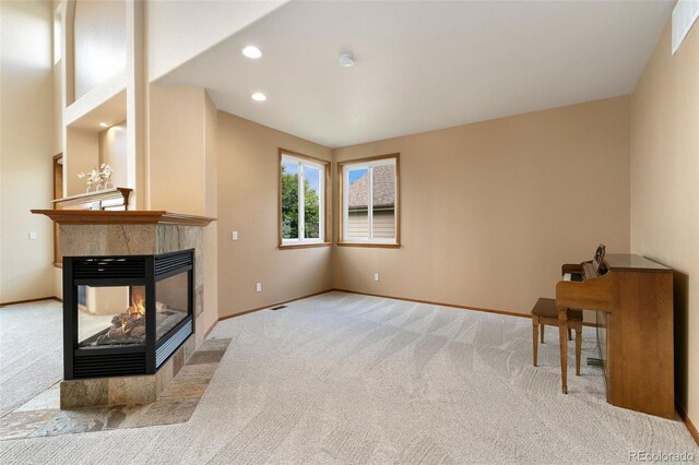 6323 S Sicily Way, Aurora, CO 80016 - unfurnished living room featuring carpet floors, baseboards, a multi sided fireplace, and recessed lighting