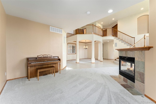 6323 S Sicily Way, Aurora, CO 80016 - living area featuring arched walkways, carpet floors, recessed lighting, and baseboards