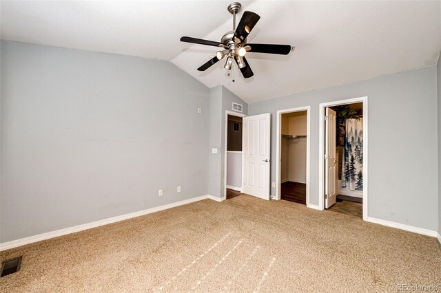 5660 S Algonquian Way Unit C, Aurora, CO 80016 - unfurnished bedroom featuring carpet flooring, baseboards, visible vents, and vaulted ceiling