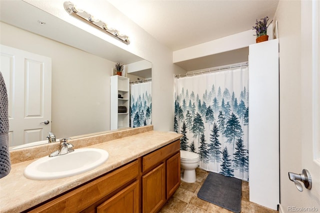 bathroom with toilet, a shower with shower curtain, and vanity