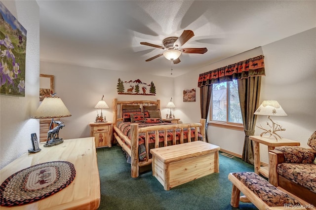 bedroom with ceiling fan and dark colored carpet