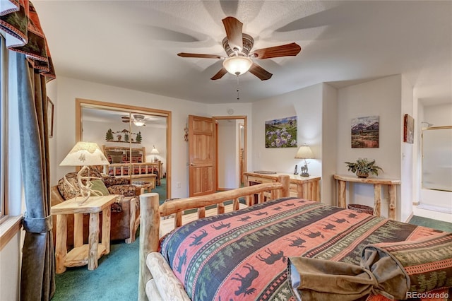 carpeted bedroom featuring ceiling fan and a closet