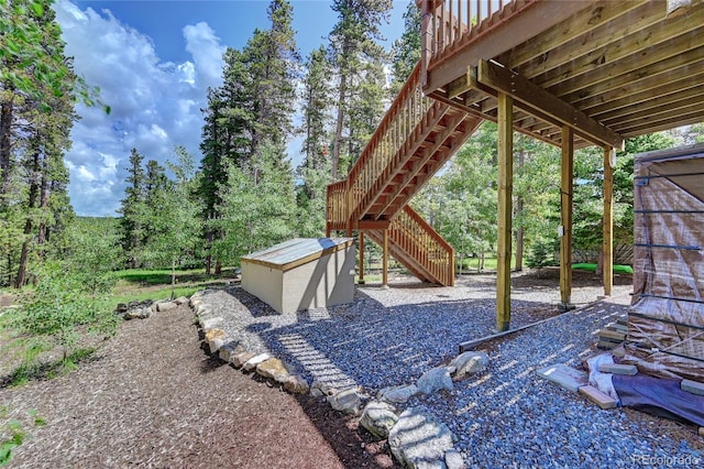 view of yard with a wooden deck